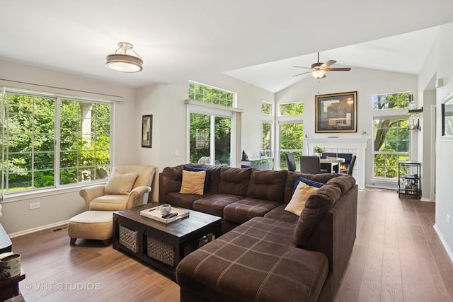 30W020 Mayfair Ct Unit 20, Warrenville, IL 60555 - living room featuring a ceiling fan, wood finished floors, a fireplace, and lofted ceiling