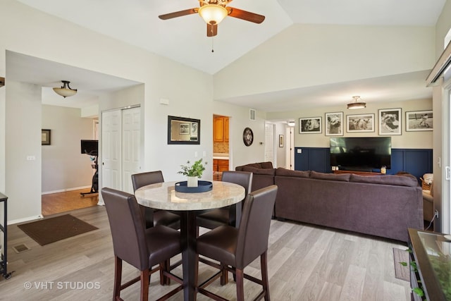 30W020 Mayfair Ct Unit 20, Warrenville, IL 60555 - dining room with a ceiling fan, light wood-type flooring, and high vaulted ceiling