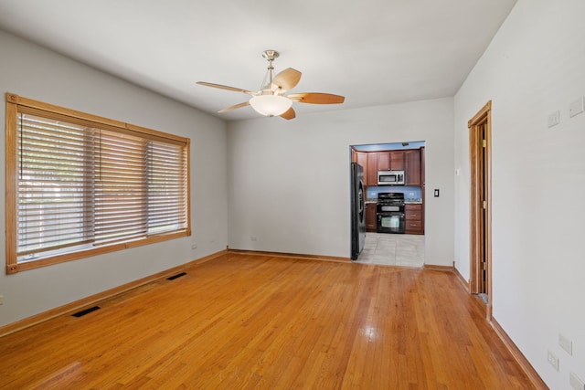 26050 S Locust Pl, Monee, IL 60449 - unfurnished room with a ceiling fan and light wood-style floors