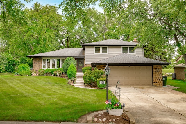 9S339 Cumnor Rd, Downers Grove, IL 60516 - split level home with brick siding, driveway, an attached garage, and a front lawn