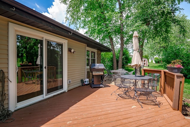 9S339 Cumnor Rd, Downers Grove, IL 60516 - deck with outdoor dining area and a grill