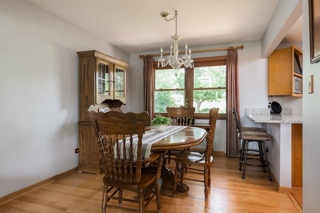 9S339 Cumnor Rd, Downers Grove, IL 60516 - dining area with a chandelier and light wood finished floors