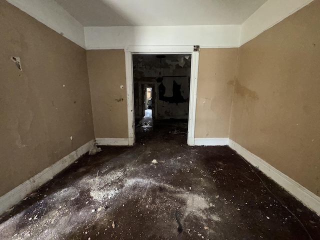 4022 W Carroll Ave, Chicago, IL 60624 - unfurnished bedroom with unfinished concrete flooring and baseboards