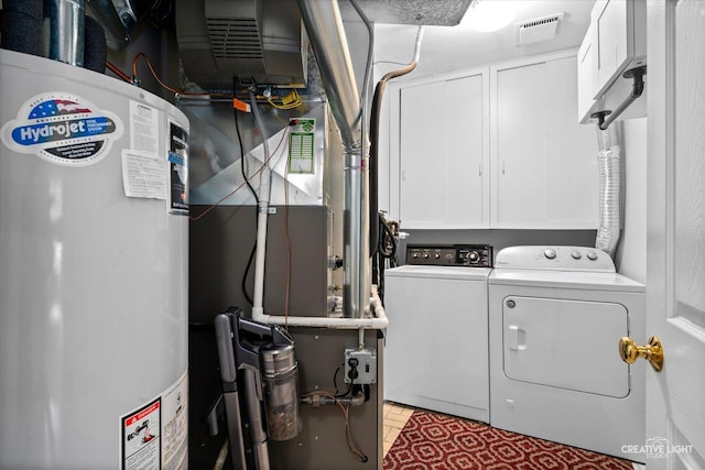 1703 Lakecliffe Dr Unit D, Wheaton, IL 60189 - laundry room featuring washing machine and clothes dryer, gas water heater, and cabinet space