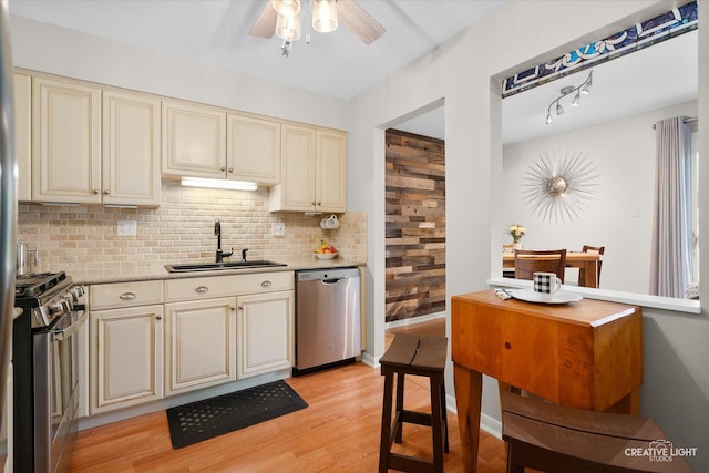 1703 Lakecliffe Dr Unit D, Wheaton, IL 60189 - kitchen featuring stainless steel appliances, cream cabinetry, ceiling fan, backsplash, and light wood finished floors