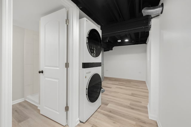 638 S Cuyler Ave, Oak Park, IL 60304 - laundry area with stacked washer and clothes dryer and wood finished floors