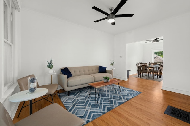 638 S Cuyler Ave, Oak Park, IL 60304 - living area featuring a ceiling fan, wood finished floors, and crown molding