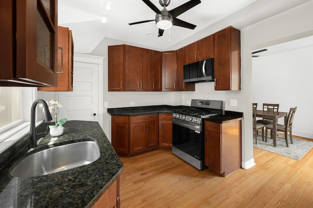 638 S Cuyler Ave, Oak Park, IL 60304 - kitchen with stainless steel range with gas cooktop, light wood-style floors, a ceiling fan, dark stone countertops, and vaulted ceiling