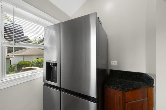 638 S Cuyler Ave, Oak Park, IL 60304 - detailed view of stainless steel fridge, brown cabinetry, and dark stone counters