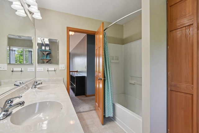 2590 Hennig Rd, Hampshire, IL 60140 - bathroom with shower / washtub combination, double vanity, and tile patterned flooring