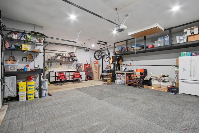 2590 Hennig Rd, Hampshire, IL 60140 - garage with freestanding refrigerator and a workshop area