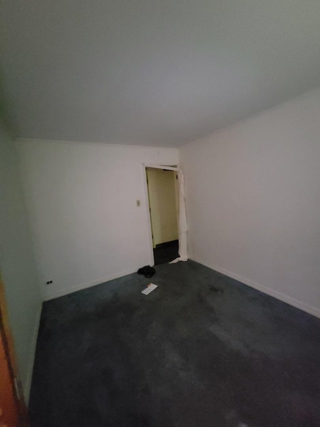 569 Lakewood Blvd, Park Forest, IL 60466 - empty room featuring dark carpet and baseboards