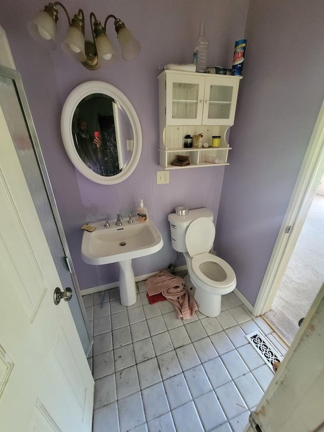 569 Lakewood Blvd, Park Forest, IL 60466 - bathroom featuring toilet and tile patterned flooring