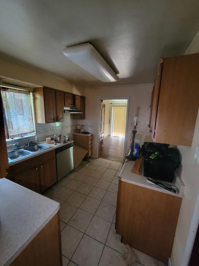 569 Lakewood Blvd, Park Forest, IL 60466 - kitchen with dishwasher, light tile patterned floors, light countertops, and brown cabinetry