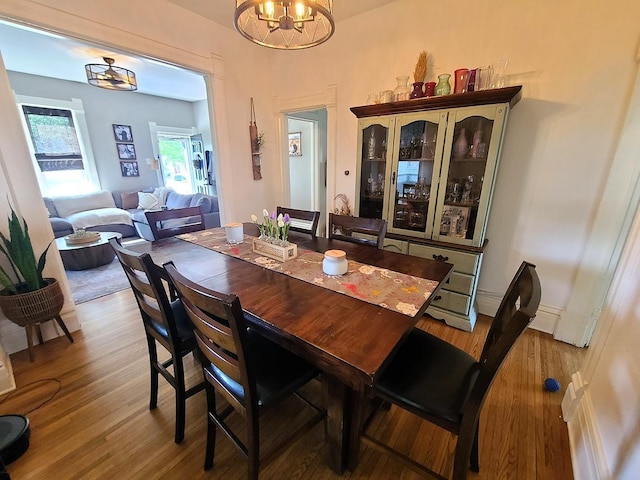 313 S 4th St, Oregon, IL 61061 - dining room featuring a chandelier and wood finished floors