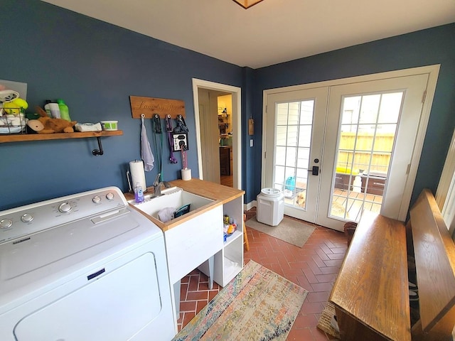 313 S 4th St, Oregon, IL 61061 - laundry room with washer / clothes dryer, french doors, and brick floors