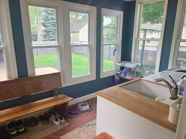 313 S 4th St, Oregon, IL 61061 - entryway featuring brick flooring and healthy amount of natural light