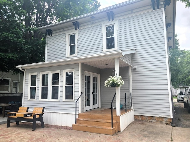 313 S 4th St, Oregon, IL 61061 - rear view of property with french doors and a patio