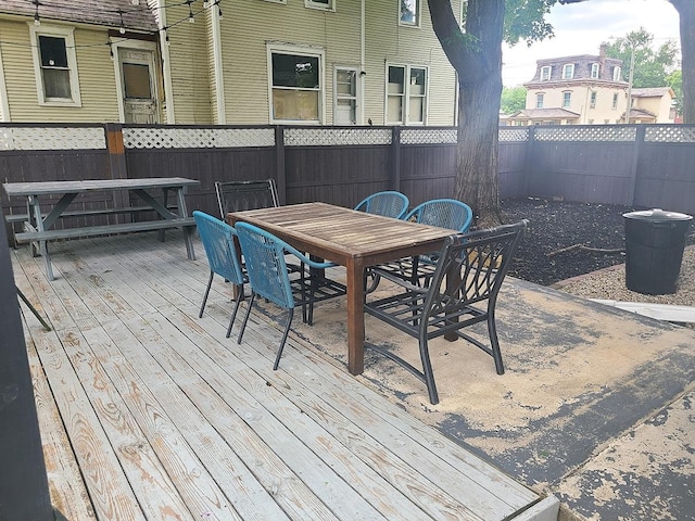 313 S 4th St, Oregon, IL 61061 - wooden terrace with outdoor dining space and a fenced backyard