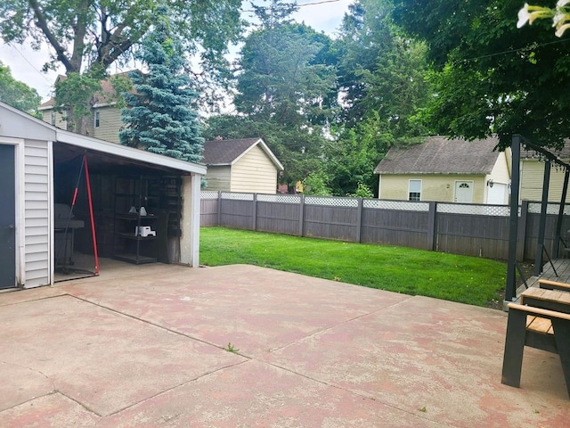 313 S 4th St, Oregon, IL 61061 - fenced backyard with a patio area