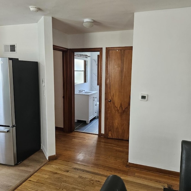 5823 W Addison St, Chicago, IL 60634 - kitchen with freestanding refrigerator and wood finished floors