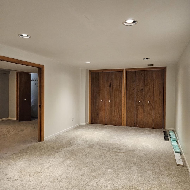5823 W Addison St, Chicago, IL 60634 - unfurnished bedroom with carpet floors, recessed lighting, and multiple closets