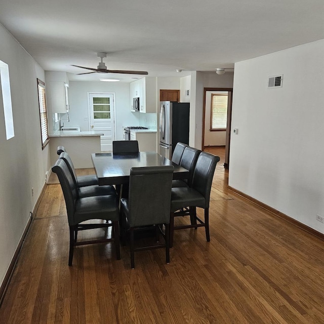 5823 W Addison St, Chicago, IL 60634 - dining room featuring dark wood-style flooring, plenty of natural light, and ceiling fan