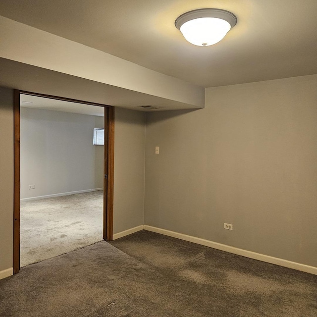 5823 W Addison St, Chicago, IL 60634 - finished basement featuring dark colored carpet and baseboards