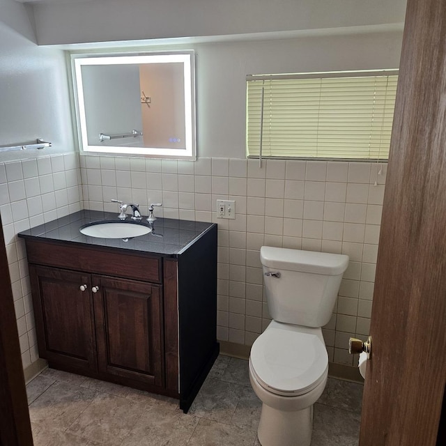 5823 W Addison St, Chicago, IL 60634 - bathroom with vanity and tile walls
