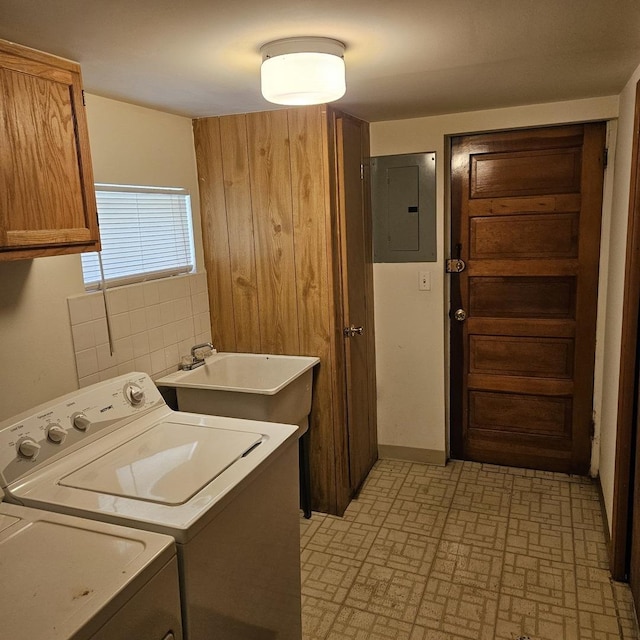 5823 W Addison St, Chicago, IL 60634 - washroom featuring cabinet space, electric panel, independent washer and dryer, and brick patterned floors
