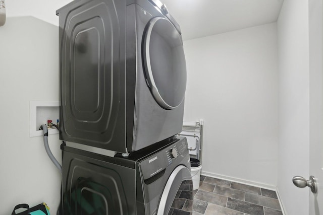 1917 Turtle Creek Ct, Aurora, IL 60503 - laundry room featuring estacked washer and dryer and stone finish floors