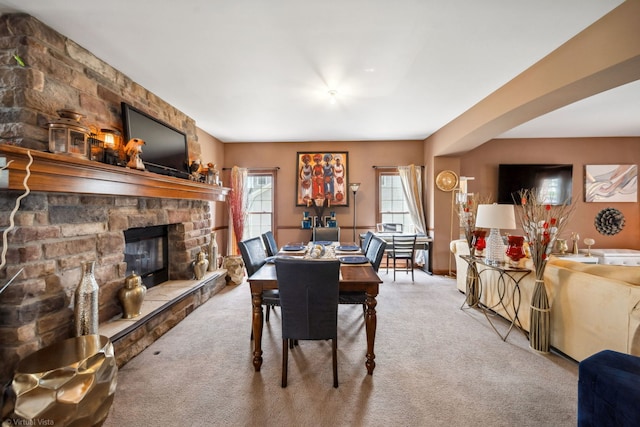 26200 W Chatham Dr, Plainfield, IL 60585 - carpeted dining room with plenty of natural light and a stone fireplace