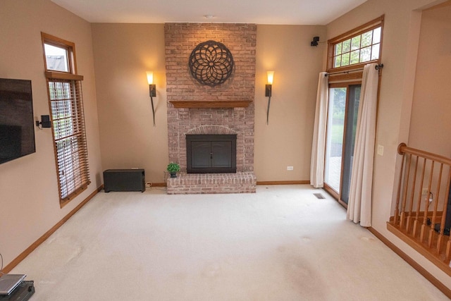 14803 S Hawthorn Cir, Plainfield, IL 60544 - unfurnished living room featuring a fireplace and carpet