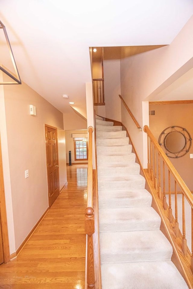 14803 S Hawthorn Cir, Plainfield, IL 60544 - staircase featuring wood finished floors, lofted ceiling, and recessed lighting