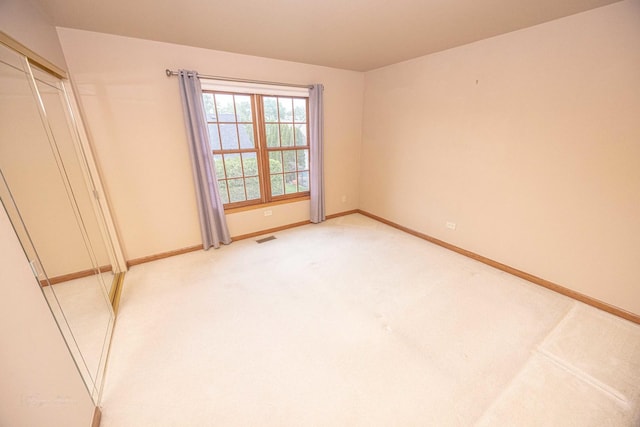 14803 S Hawthorn Cir, Plainfield, IL 60544 - unfurnished bedroom featuring baseboards and light colored carpet