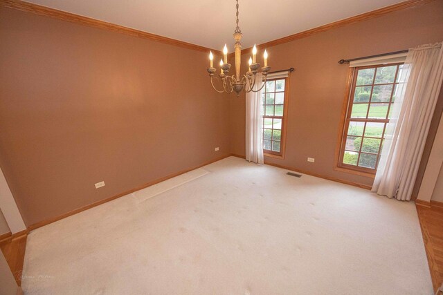 14803 S Hawthorn Cir, Plainfield, IL 60544 - spare room with a chandelier, ornamental molding, and light colored carpet