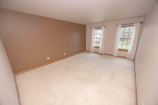 14803 S Hawthorn Cir, Plainfield, IL 60544 - empty room featuring baseboards and light carpet