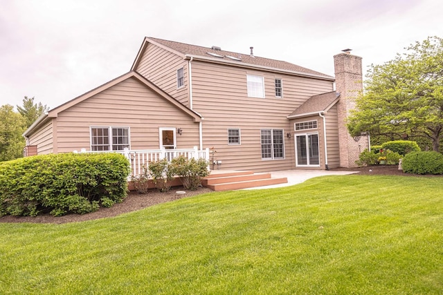14803 S Hawthorn Cir, Plainfield, IL 60544 - rear view of property featuring a deck, a chimney, a lawn, and a patio