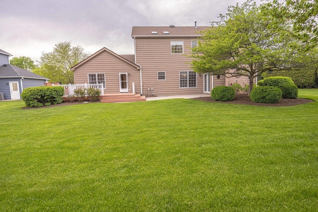14803 S Hawthorn Cir, Plainfield, IL 60544 - rear view of property featuring a lawn, a patio area, and a deck