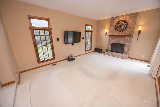 14803 S Hawthorn Cir, Plainfield, IL 60544 - unfurnished living room with a fireplace, healthy amount of natural light, and carpet flooring