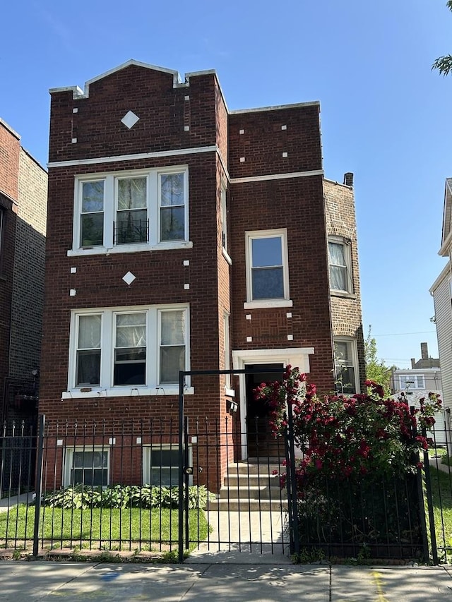 3247 W Berteau Ave, Chicago, IL 60618 - front of property featuring brick siding and a fenced front yard