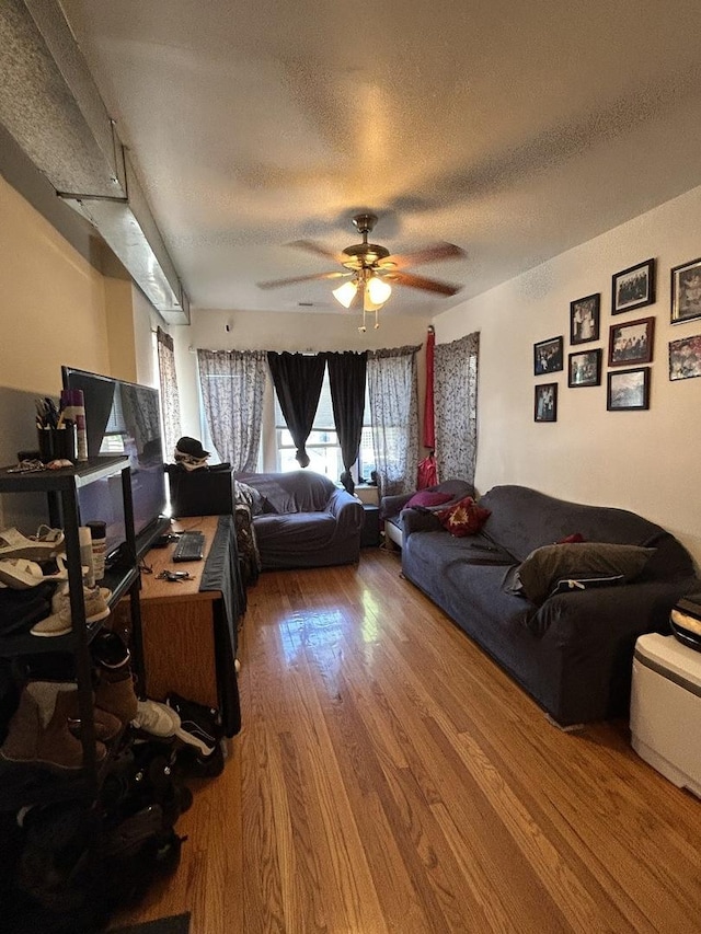 3247 W Berteau Ave, Chicago, IL 60618 - living room with wood finished floors, a ceiling fan, and a textured ceiling