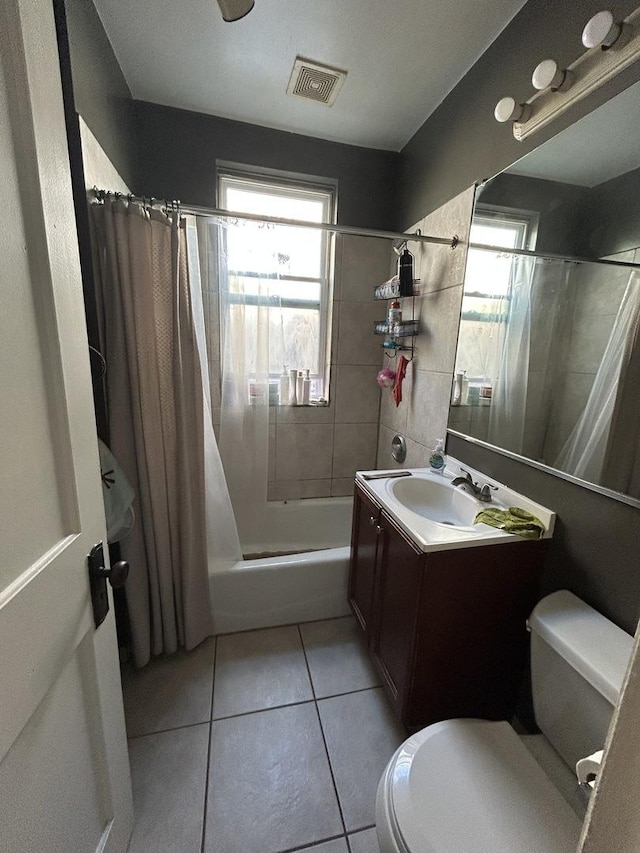 3247 W Berteau Ave, Chicago, IL 60618 - bathroom with shower / bath combination with curtain, tile patterned floors, and vanity