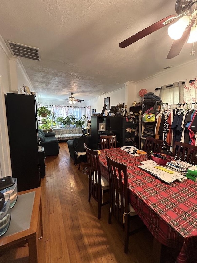 3247 W Berteau Ave, Chicago, IL 60618 - dining area with ceiling fan, hardwood / wood-style floors, a textured ceiling, and ornamental molding