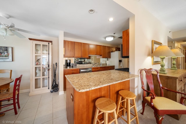 865 E 22nd St Unit 214, Lombard, IL 60148 - kitchen featuring dishwasher, white refrigerator with ice dispenser, brown cabinets, a peninsula, and a ceiling fan