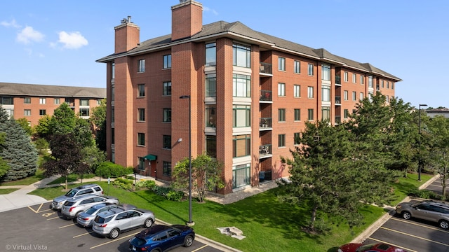 865 E 22nd St Unit 214, Lombard, IL 60148 - view of building exterior with uncovered parking