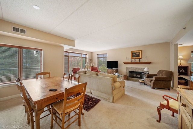 865 E 22nd St Unit 214, Lombard, IL 60148 - dining room with light carpet and a fireplace