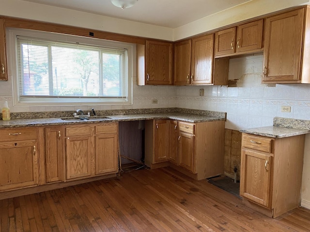 1024 W 108th St, Chicago, IL 60643 - kitchen featuring hardwood / wood-style flooring, backsplash, and brown cabinets