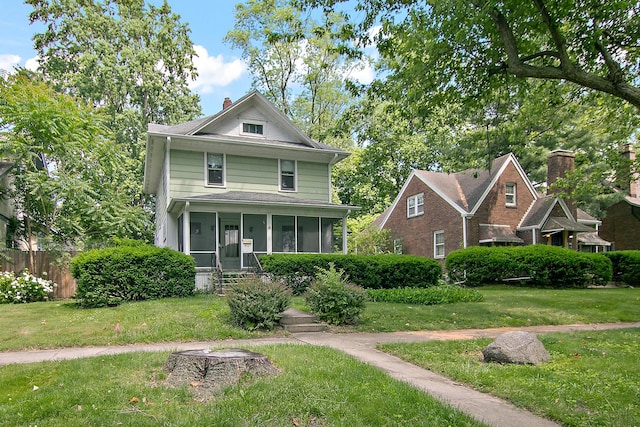 866 S Evergreen Ave, Kankakee, IL 60901 - traditional style home featuring a sunroom and a chimney