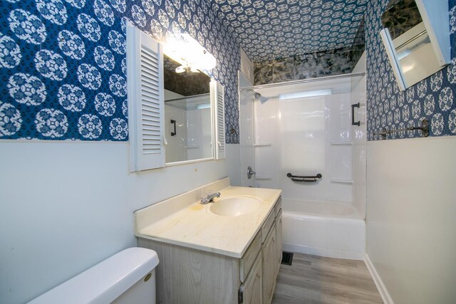 866 S Evergreen Ave, Kankakee, IL 60901 - full bathroom with vanity, tub / shower combination, wood finished floors, and wallpapered walls